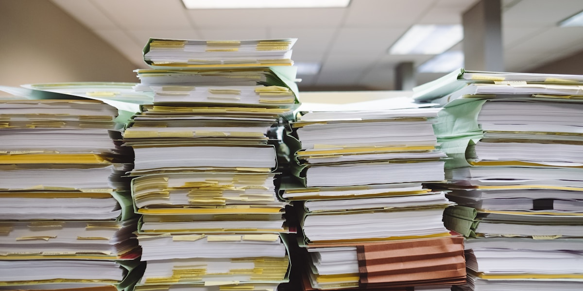 Cluttered file folders and paperwork
